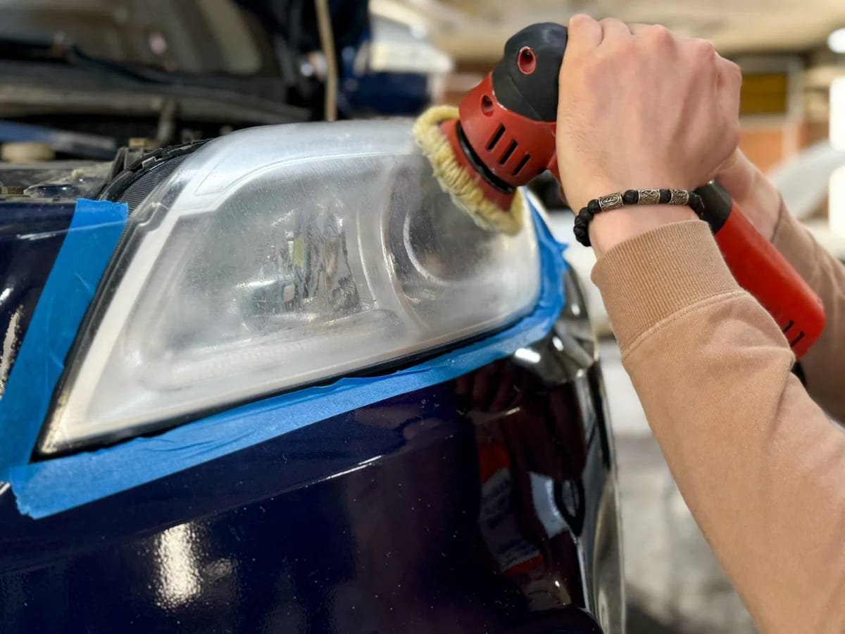 Technician Polishing Headlight