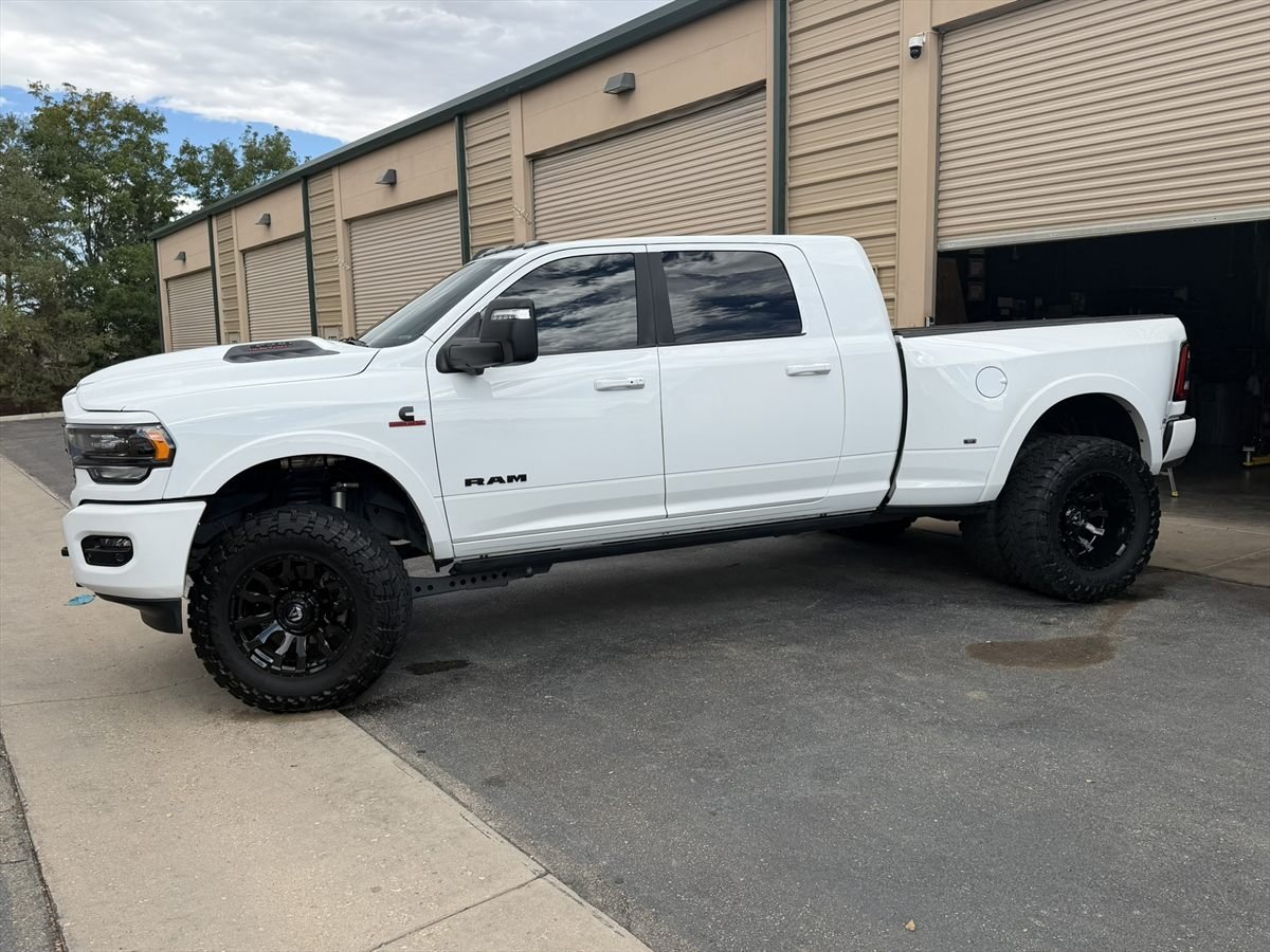 White Ram 2500 parked outside the Adams Auto Restyling shop in Windsor after a full exterior detail